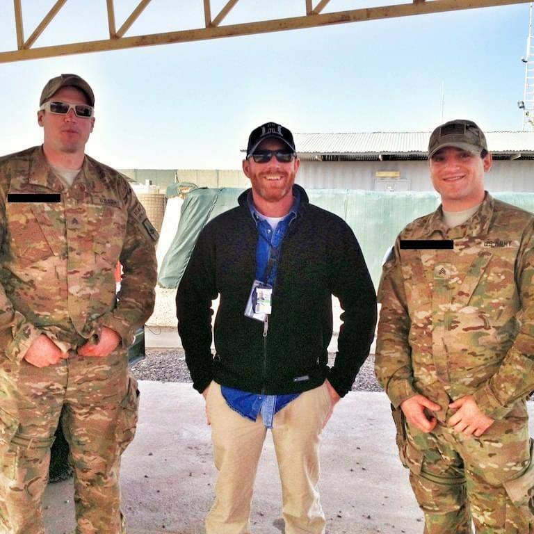 John Wright with service members overseas